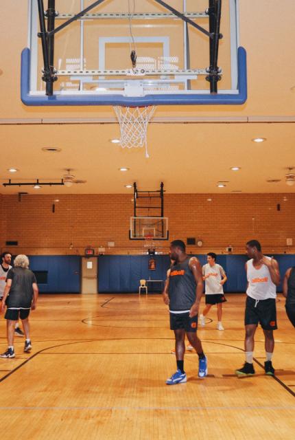 Basketball gym with people playing
